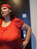 Naughty mature chick in a red blouse and bandana exposing her mega tits